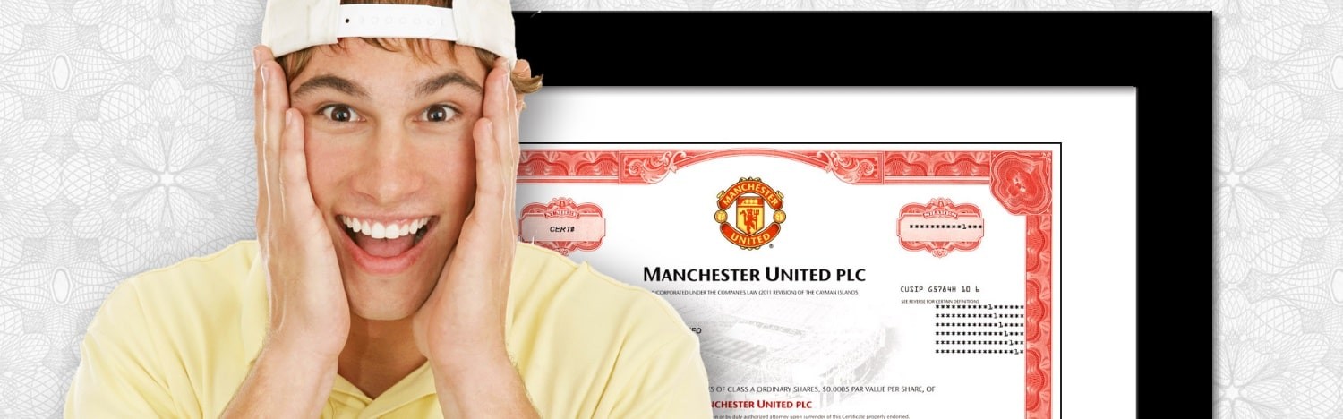 young man with framed manchester united stock