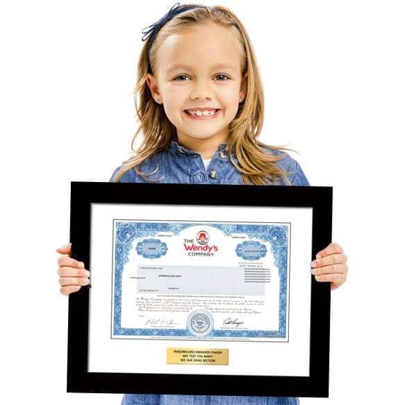 Teen holding a shareholder kit
